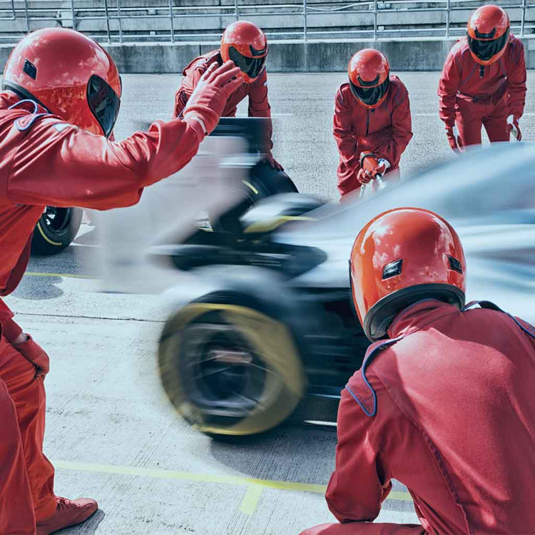 Formula 1 pit crew team in action to promote Goober & Doofus's F1 Teams Series t-shirts